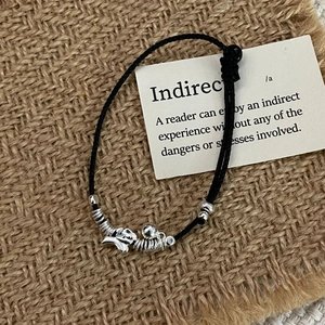 Detail of handmade black cord bracelet with S925 silver elephant charm and beads