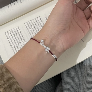 925 silver puppy charm on red braided rope bracelet with bells for women