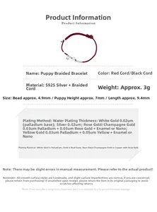 Detail showing S925 silver puppy charm and bell on handmade red woven rope bracelet