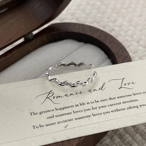Macro detail of S925 sterling silver olive leaf ring with cubic zirconia inlays