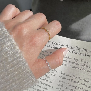 Minimalist S925 sterling silver olive leaf rings with stones on a female model finger