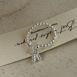 Detailed close-up of S925 sterling silver beaded ring with gourd and disk charms