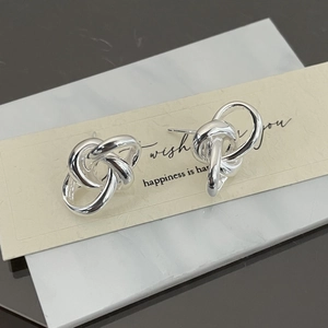 Minimalist S925 sterling silver knotted stud earrings with elegant intertwined design
