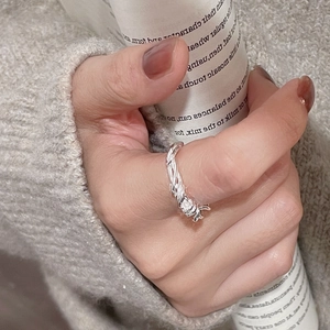 Detail shot of the silver barbed wire twisted line ring in S925 sterling silver