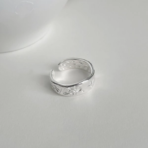 Detail showing handcrafted hammered texture and star pattern on S925 silver open ring