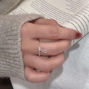 Minimalist S925 sterling silver hollow heart open ring on finger with cozy aesthetic