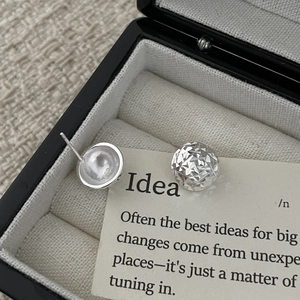 Detailed view of S925 sterling silver hemispherical stud earrings with S925 hallmark