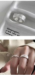 Macro detail of 925 sterling silver hammered starburst ring with adjustable open band