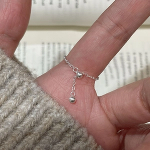 Close-up of adjustable 925 sterling silver chain ring with minimalist polished double beads