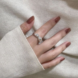 Macro shot of S925 sterling silver irregular ring with smooth polished metallic finish