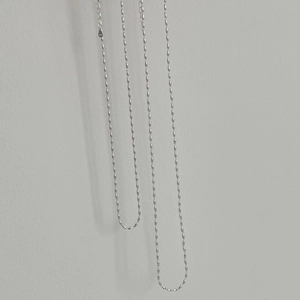 Detail of S925 sterling silver rice bead necklace with adjustable chain and hallmark tag