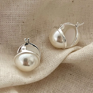 Elegant 925 sterling silver hoop earrings featuring two large lustrous white pearls