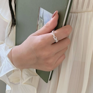 Minimalist 925 sterling silver heart chain open ring shown on model finger