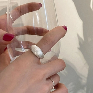 S925 sterling silver minimalist wide ring with a brushed matte finish worn by a model