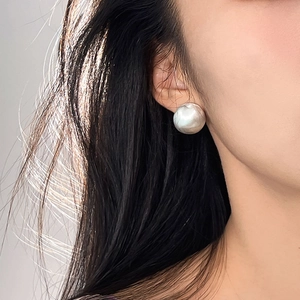 Elegant silver brushed sphere S925 sterling silver earrings on model in minimalist style