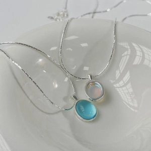 Detailed macro view of S925 sterling silver necklaces featuring oval moonstone pendants