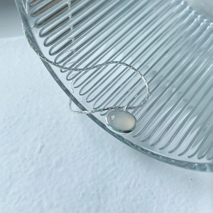 Elegant S925 silver necklace featuring an oval chalcedony pendant on a thin silver chain