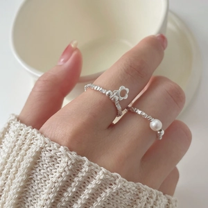 Elegant 925 sterling silver flower and pearl ring set with a unique textured silver finish