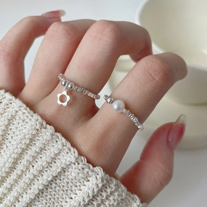 925 silver beaded rings featuring a delicate flower pendant and elegant white pearl