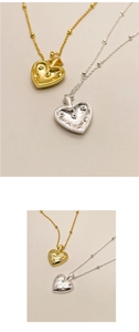 Macro shot showing S925 hallmark on the back of a minimalist heart pendant necklace