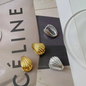 Elegant S925 sterling silver shell earrings with textured gold and silver finish