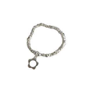 Minimalist 925 sterling silver ring with hammered texture and flower charm