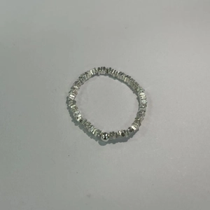 Detailed macro view of minimalist S925 silver ring featuring irregular nuggets and a pearl