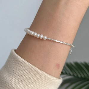 Detail view of 925 sterling silver bead bracelet with natural freshwater pearls and extender
