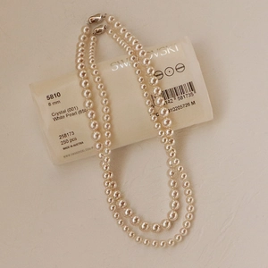 Classic double-strand white pearl necklace with 8mm crystals and silver clasp closure