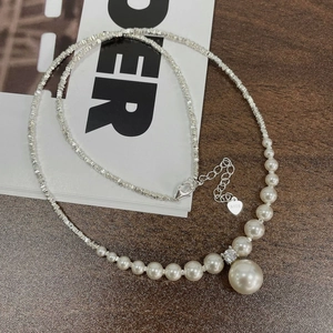 Elegant 925 silver necklace featuring gradient pearls and a heart pendant with S925 stamp