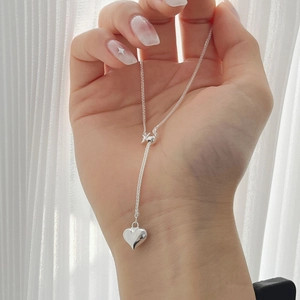 Detailed shot of 925 sterling silver heart necklace with adjustable sliding bead chain