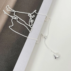 Detailed shot of S925 sterling silver long heart necklace with adjustable sliding bead