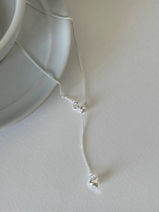 Detail of 925 sterling silver heart necklace featuring adjustable bead and spring clasp