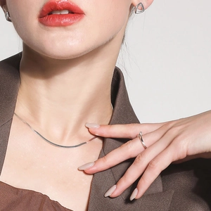 Detailed view of minimalist S925 sterling silver blade choker necklace and ring set