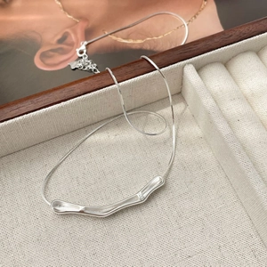 Minimalist S925 sterling silver necklace with irregular curved bar pendant on snake chain