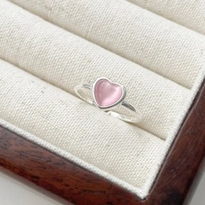 Minimalist S925 sterling silver ring with a pink heart cat-eye stone in a jewelry box