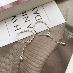 Detail of adjustable S925 sterling silver chain rings with mesh weave and tassel style