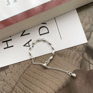Adjustable S925 sterling silver beaded bracelet with polished metallic finish and pull chain