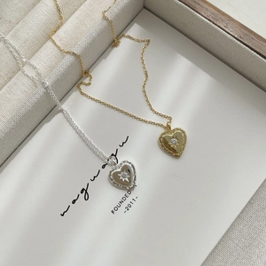 Elegant S925 sterling silver heart pendant necklace with sparkling starburst cubic zirconia