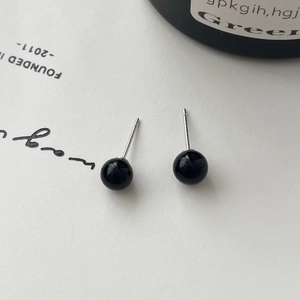 Detailed macro view showing the S925 hallmark on minimalist black onyx stud earrings