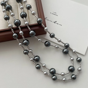 Elegant double-layer gradient grey pearl necklace with textured silver metal bead accents