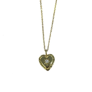 Minimalist S925 gold heart necklace with a sparkling starburst zircon pendant for women