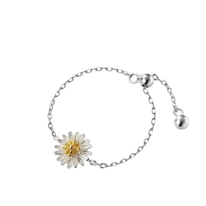 Adjustable S925 sterling silver daisy chain ring with yellow flower center on white background