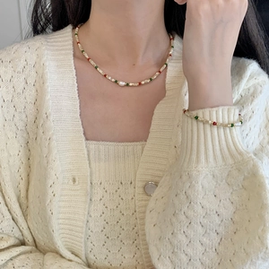 Detail view of handmade beaded S925 silver necklace and bracelet set with freshwater pearls