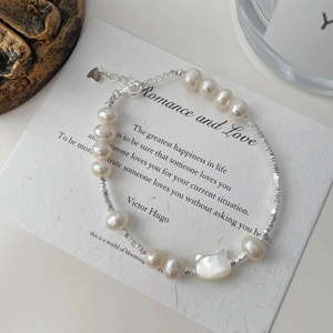 Macro shot of S925 sterling silver lobster clasp with hallmark on pearl bracelet