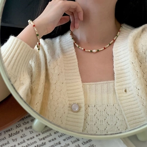 Detailed close-up of handmade beaded necklace with S925 silver and freshwater pearl accents