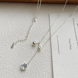 Detail of S925 sterling silver necklace with light blue pear-cut zircon and adjustable clasp