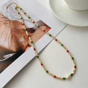 Detailed close-up of handmade S925 silver beaded necklace with freshwater pearl and shells