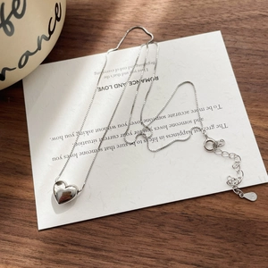 Detail of S925 sterling silver stamp on the adjustable chain of heart pendant necklace