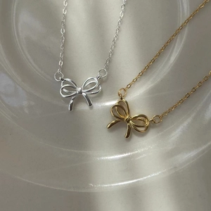 Elegant 925 sterling silver hollow bow necklace in polished gold and silver finishes